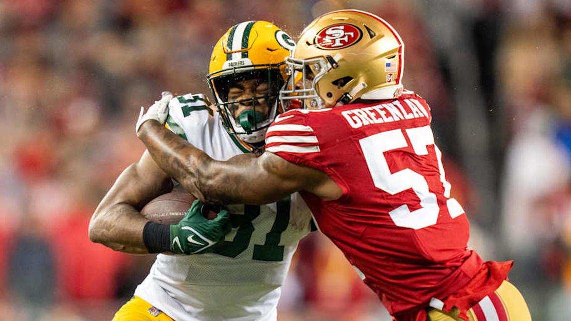  January 20, 2024; Santa Clara, CA, USA; San Francisco 49ers linebacker Dre Greenlaw (57) tackles Green Bay Packers running back Emanuel Wilson (31) during the first quarter in a 2024 NFC divisional round game at Levi's Stadium. Mandatory Credit: Kyle Terada-Imagn Images | Kyle Terada-Imagn Images 