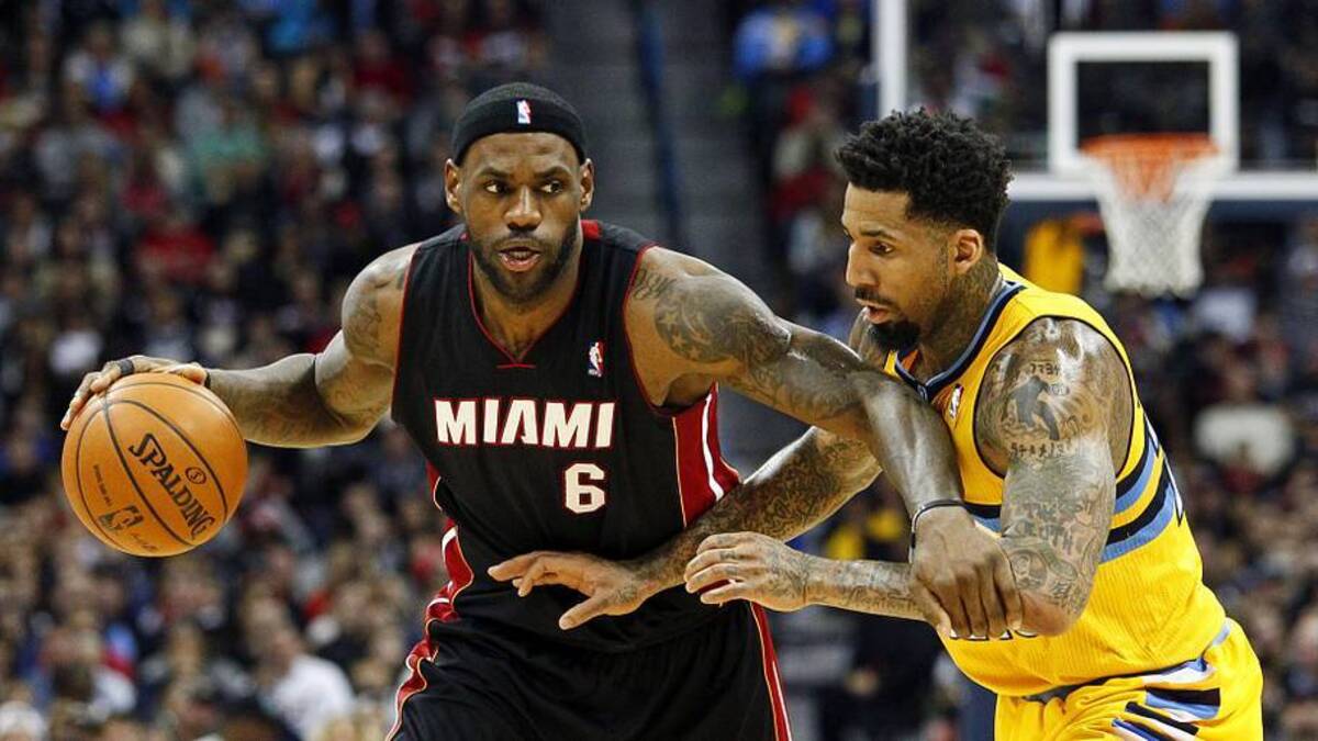  Dec 30, 2013; Denver, CO, USA; Miami Heat small forward LeBron James (6) keeps the ball from Denver Nuggets shooting guard Wilson Chandler (21) in the fourth quarter at the Pepsi Center. The Heat defeated the Nuggets 97-94. Mandatory Credit: Isaiah J. Downing-Imagn Images | Isaiah J. Downing-Imagn Images 