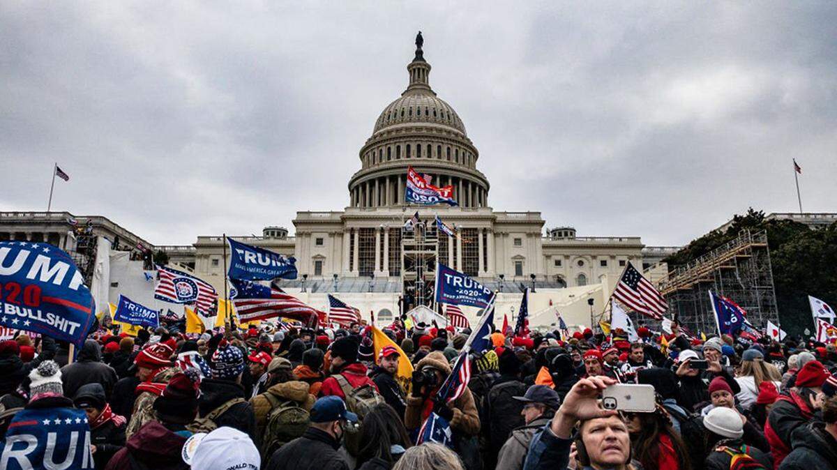 Pro-Trump supporters storm the U.S. Capitol following a rally with President Donald Trump on Jan. 6, 2021. Opponents of Trump’s $1.776 billion fund for victims of alleged political “weaponization” will face high hurdles in challenging it, according to legal experts.
