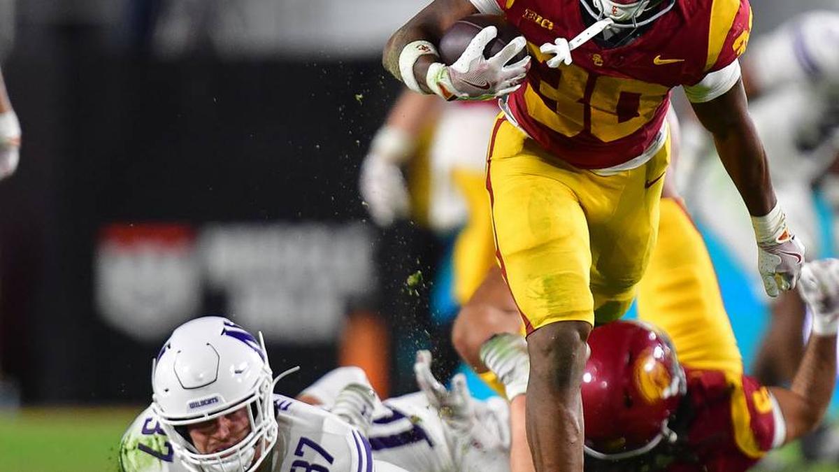  Nov 7, 2025; Los Angeles, California, USA; Southern California Trojans running back King Miller (30) runs the ball against Northwestern Wildcats linebacker Mac Uihlein (37) during the first half at the Los Angeles Memorial Coliseum. Mandatory Credit: Gary A. Vasquez-Imagn Images | Gary A. Vasquez-Imagn Images 