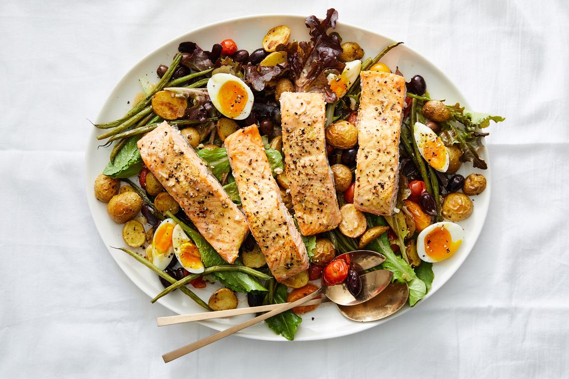 Sheet-pan roasted salmon niçoise salad. Anchovies are a sneaky secret ingredient, adding much-needed depth to certain dishes. Food styled by Barrett Washburne. (Ryan Liebe/The New York Times)