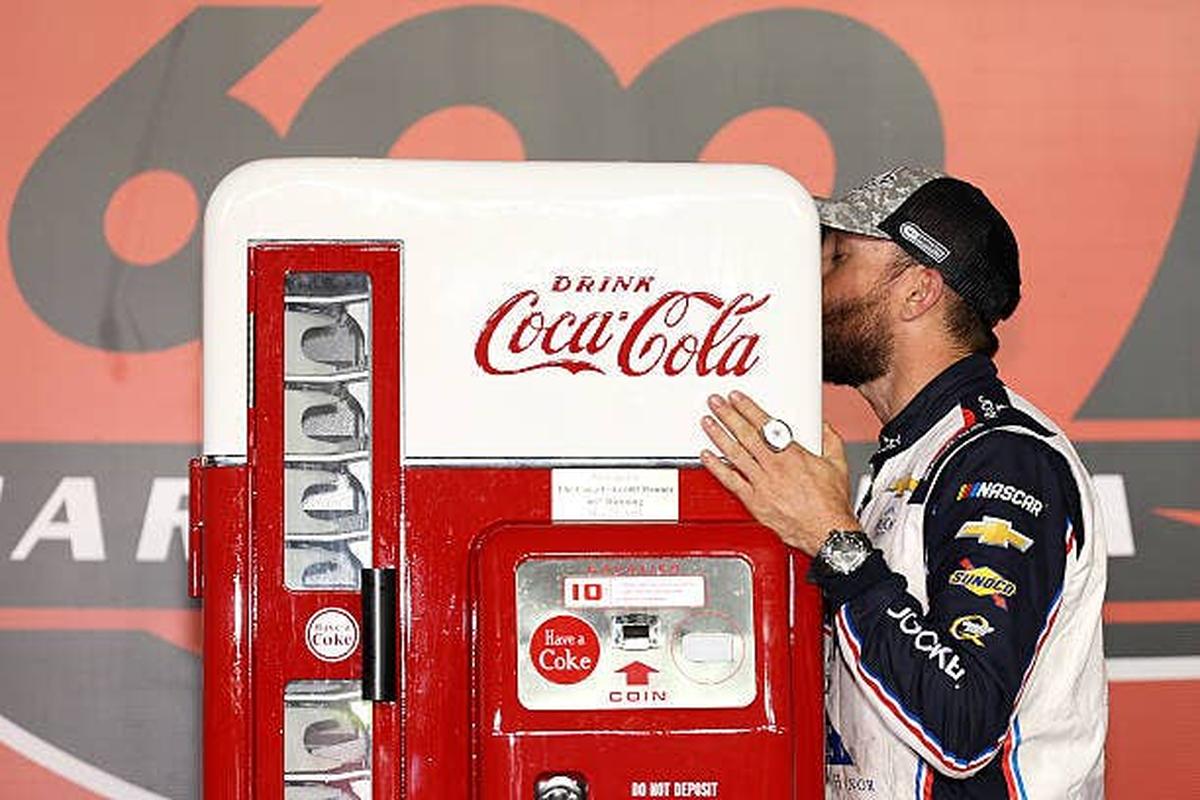  Ross Chastain Kisses His Coca-Cola Vending Machine Prize. (Photo by David Jensen/Getty Images) (Photo by David Jensen/Getty Images)