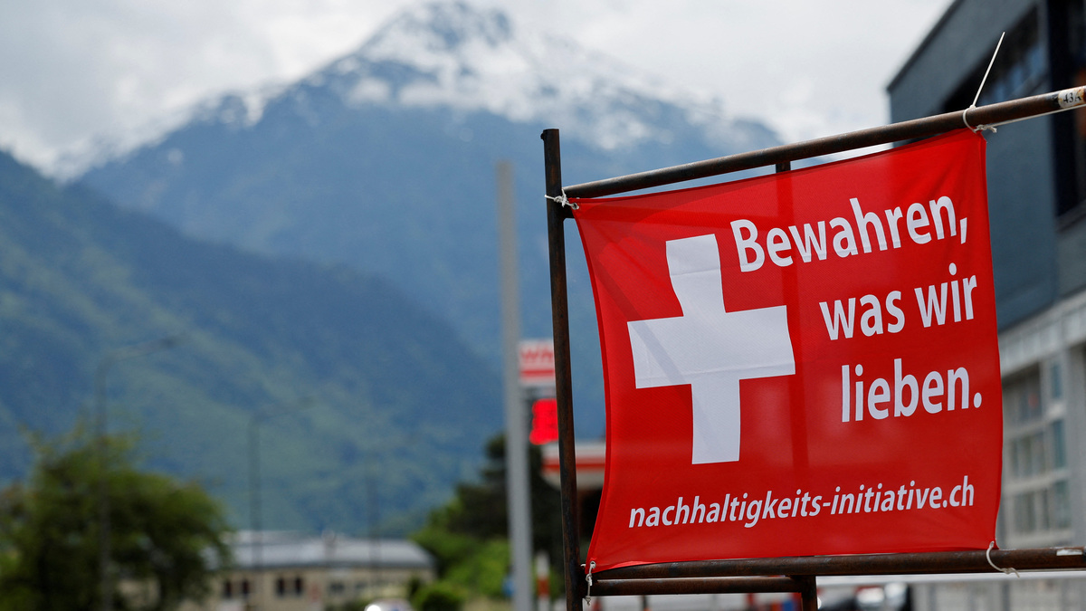 A sign is pictured ahead of a June 14 vote on a plan backed by the right-wing Swiss People's Party (SVP) to cap the population at 10 million inhabitants, in Glarus, Switzerland, May 18, 2026. The sign reads: "Preserve what we have". REUTERS/Stefan Wermuth