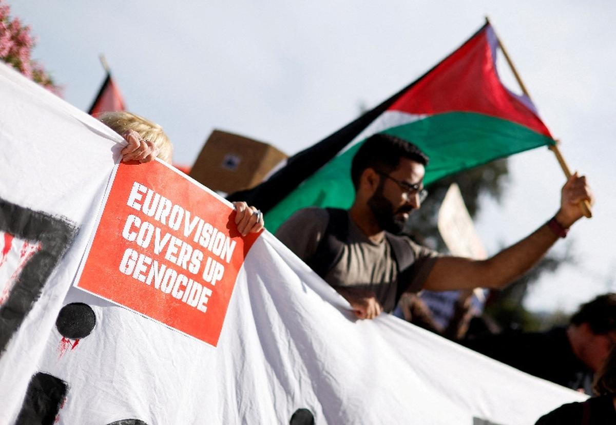 A pro-Palestinian protestor holds a poster against the Eurovision Song Contest because of Israel's participation, during a solidarity rally to mark the 78th anniversary of the Nakba to commemorate the mass dispossession of Palestinians in 1948, in Sliema, Malta, May 16, 2026. REUTERS/Darrin Zammit Lupi