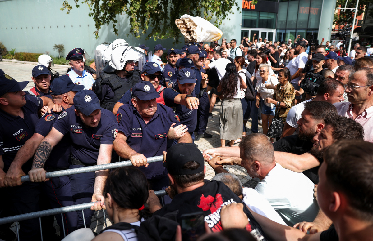 Police officers scuffle with protesters, during a demonstration against the government, following weeks of protests against a planned luxury resort backed by a company linked to Jared Kushner, the son-in-law of U.S. President Donald Trump, on an environmentally sensitive part of the Adriatic coast, in Tirana, Albania, July 2, 2026. REUTERS/Florion Goga
