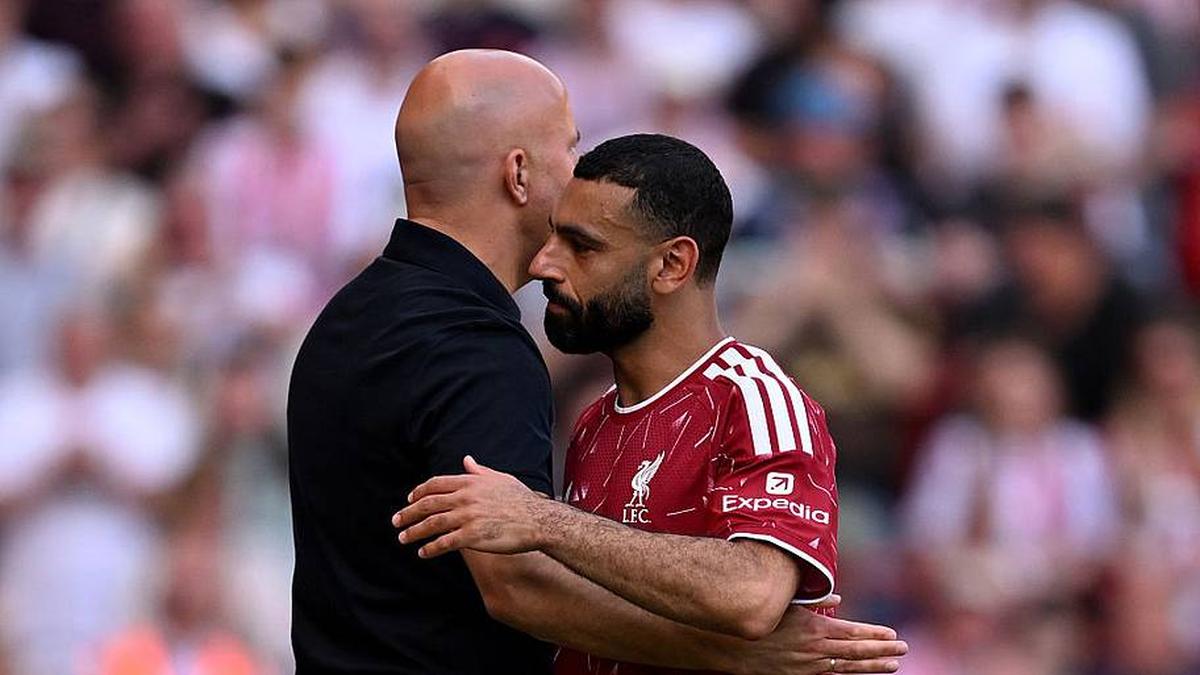  Arne Slot (left) has a tense relationship with Mohamed Salah. | Liverpool FC/Getty Images 