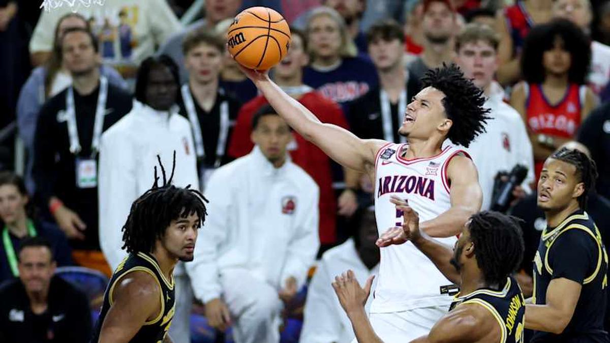  Apr 4, 2026; Indianapolis, IN, USA; Arizona Wildcats guard Brayden Burries (5) goes to the basket against Michigan Wolverines forward Morez Johnson Jr. (21) in the second half during a semifinal of the Final Four of the men's 2026 NCAA Tournament at Lucas Oil Stadium. Mandatory Credit: Trevor Ruszkowski-Imagn Images | Trevor Ruszkowski-Imagn Images 