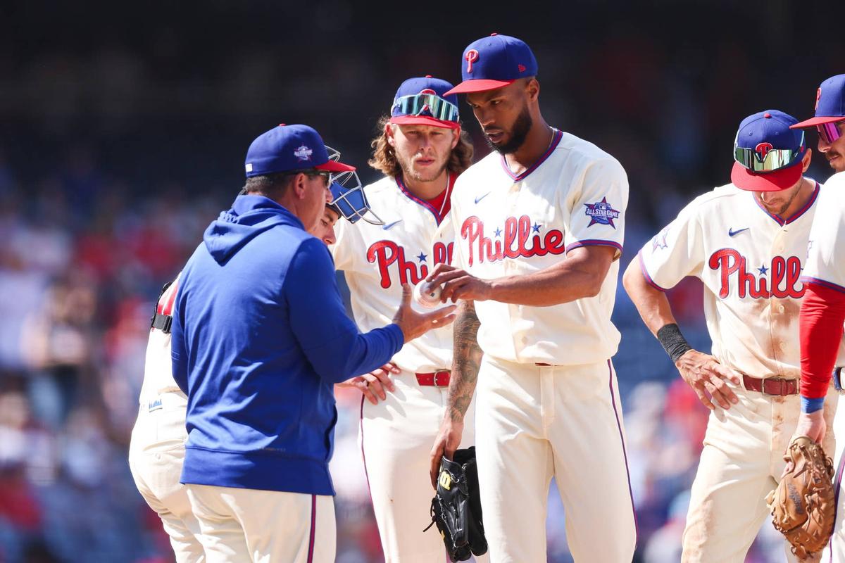  Philadelphia Phillies pitcher Cristopher Sanchez (61) hands the ball to manager Rob Thomson (blue shirt) at Citizens Bank Park. Bill Streicher-Imagn Images