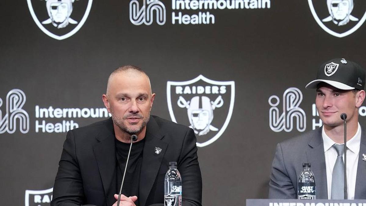  Apr 24, 2026; Henderson, NV, USA; Las Vegas Raiders quarterback Fernando Mendoza (right) and general manager John Spytek at introductory press conference at Intermountain Health Performance Center after being selected as the No. 1 pick in the 2026 NFL Draft. Mandatory Credit: Kirby Lee-Imagn Images | Kirby Lee-Imagn Images 