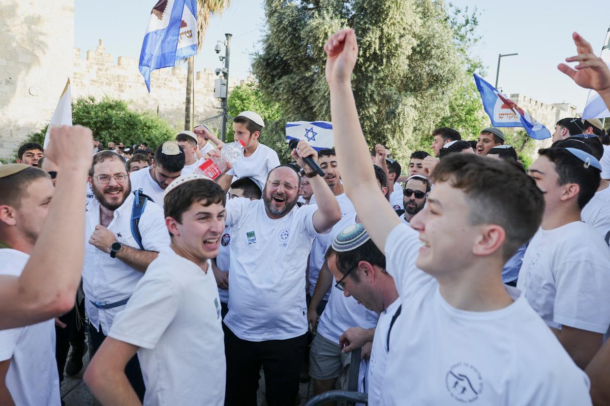 People take part in the annual Jerusalem Day march in the Old City of Jerusalem, May 14, 2026. REUTERS/Ammar Awad