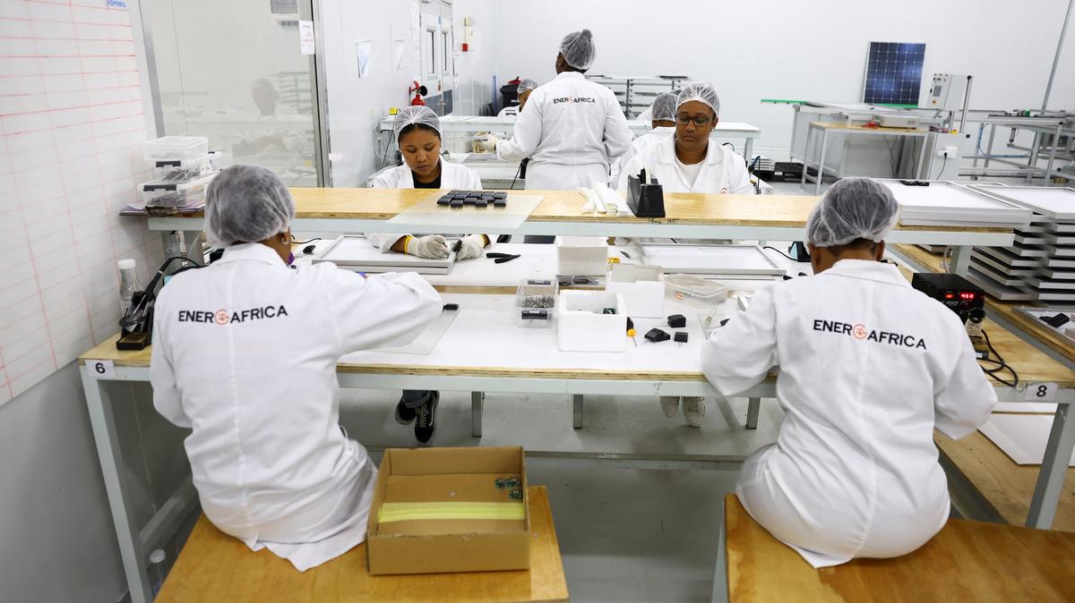 Women work at a factory called Ener-G-Africa, where they produce high-quality solar panels made by an all-women team, in Cape Town, South Africa, February 9, 2023. REUTERS/Esa Alexander