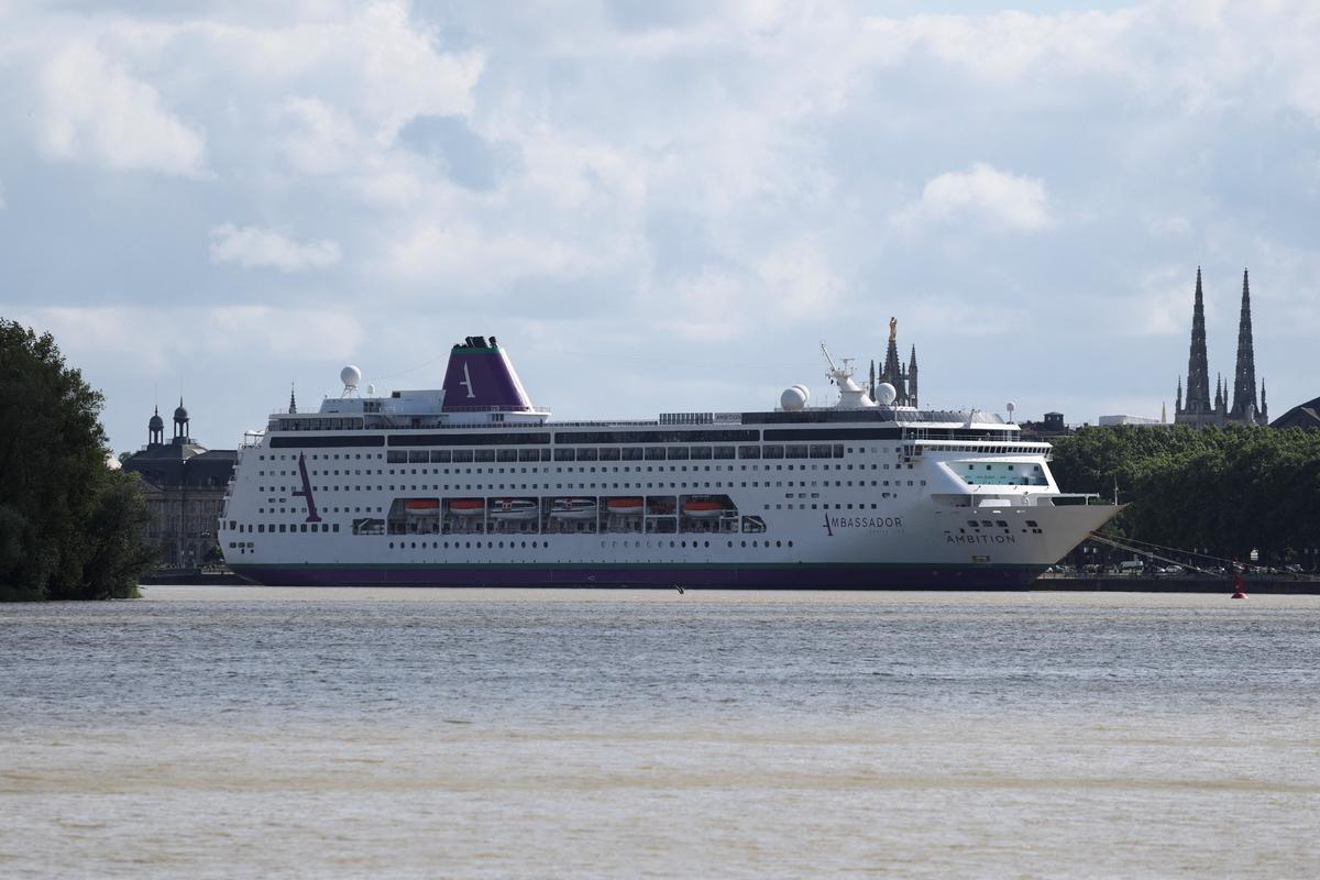 Cruise ship Ambition, operated by the Ambassador Cruise Line, is docked at the Port of Bordeaux after local authorities said passengers could not disembark following an outbreak of possible gastroenteritis reported on board, in Bordeaux, France, May 13, 2026. REUTERS/Stephane Mahe