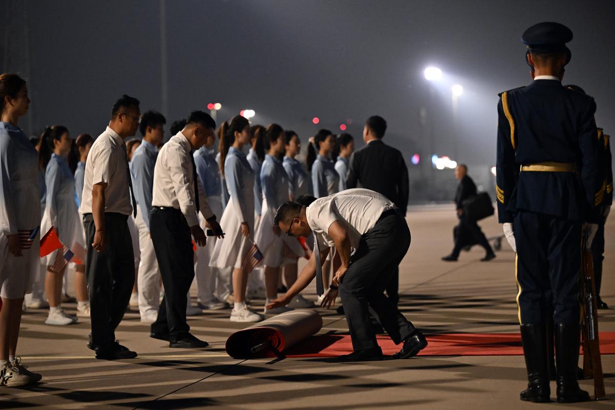 A red carpet is laid down in preparation for the arrival of President Donald Trump at Beijing Capital International Airport in Beijing, China, on Wednesday, May 13, 2026. Trump is in China for a two-day summit with China's leader, Xi Jinping. (Kenny Holston/The New York Times)