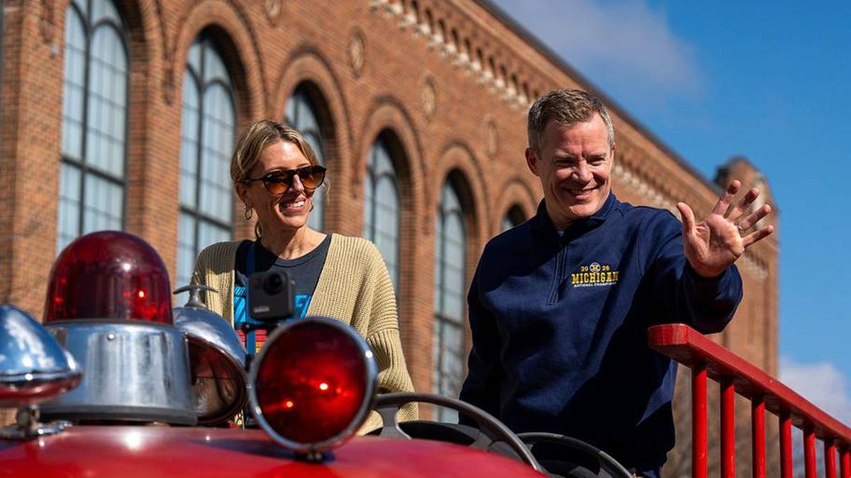  Dusty May celebrated Michigan's national championship (here with his wife, Anna May), but truly savoring it has seemed difficult. | David Rodriguez Muñoz / USA TODAY NETWORK via Imagn Images 