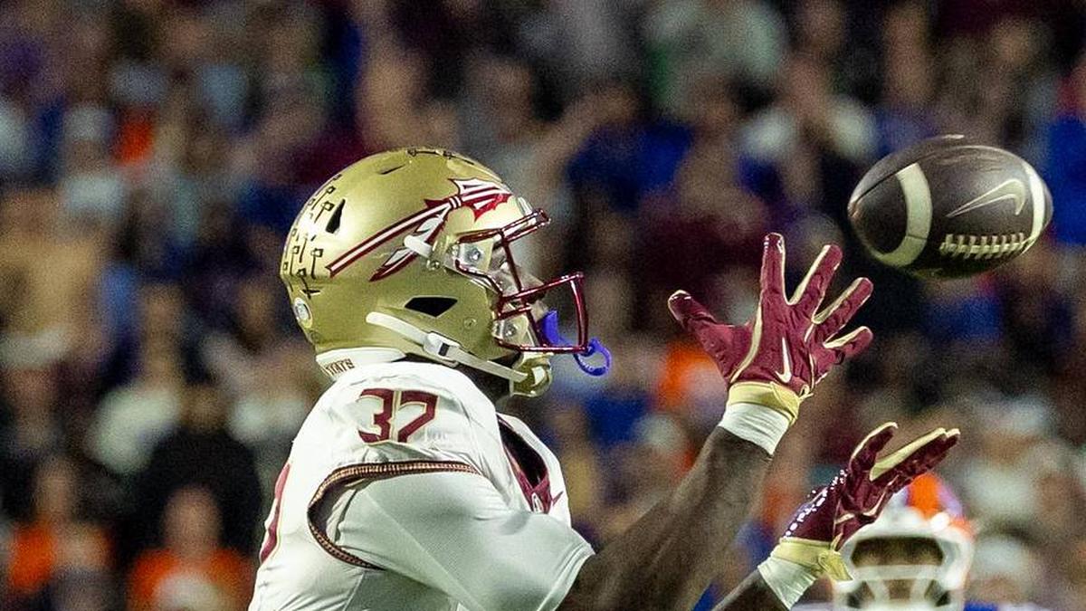  Nov 29, 2025; Gainesville, Florida, USA; Florida State Seminoles running back Ousmane Kromah (32) drops the ball during the second quarter against the Florida Gators at Ben Hill Griffin Stadium. Mandatory Credit: Bob Kupbens-Imagn Images | Bob Kupbens-Imagn Images 