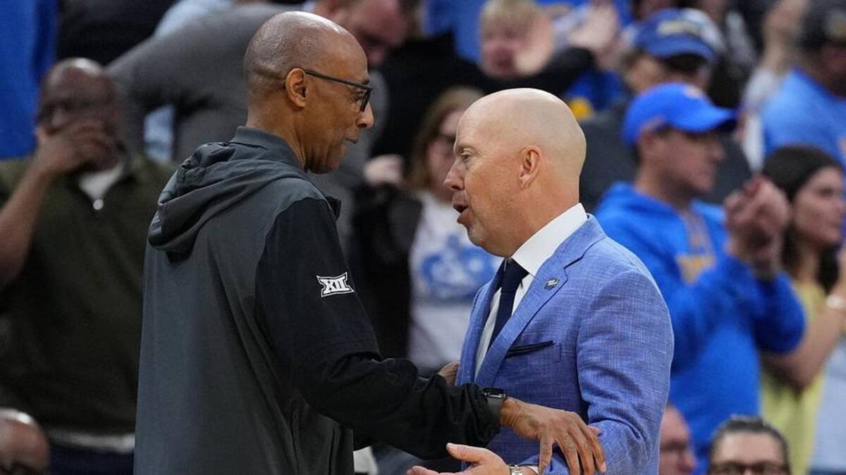  Mar 20, 2026; Philadelphia, PA, USA; UCLA Bruins head coach Mick Cronin and UCF Knights head coach Johnny Dawkins shake hands after the game during a first round game of the men's 2026 NCAA Tournament at Xfinity Mobile Arena. Mandatory Credit: Kyle Ross-Imagn Images | Kyle Ross-Imagn Images 