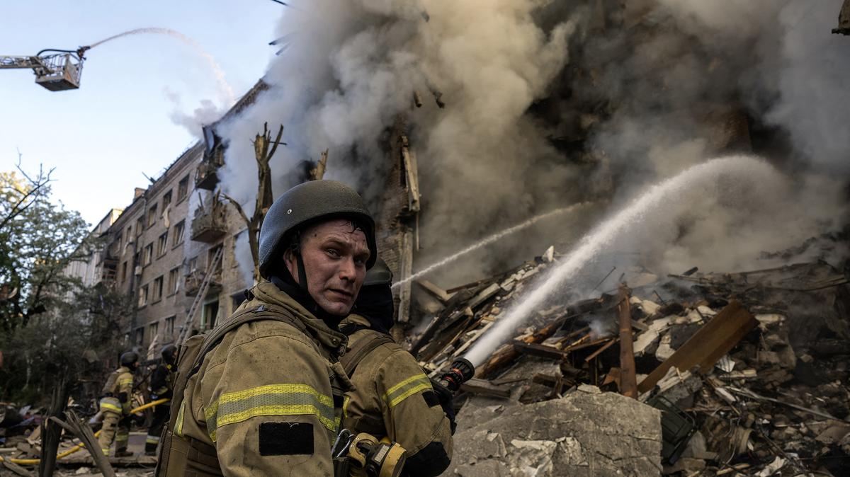 Firefighters work to extinguish a fire at the site of a heavily damaged building following Russian strikes to the Ukrainian capital in Kyiv on Sunday, May 24, 2026, amid the Russian invasion of Ukraine. (Vladyslav Musienko/AFP/Getty Images/TNS)