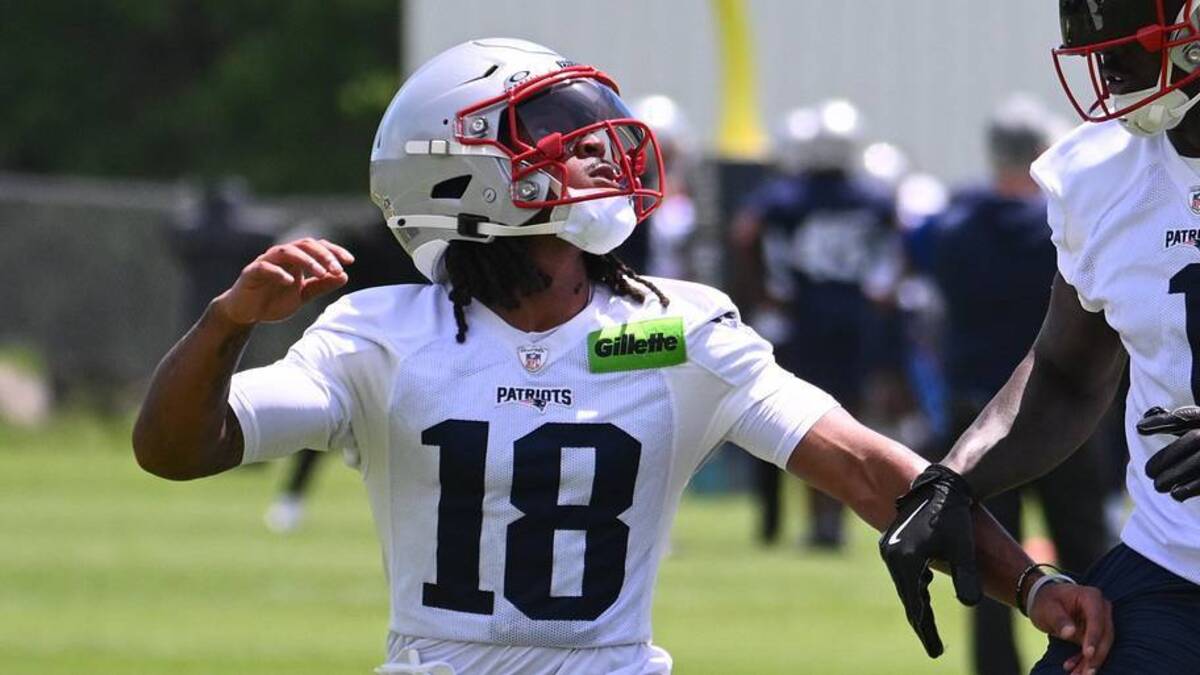  Jun 2, 2026; Foxborough, MA, USA; New England Patriots wide receiver Kyle Williams (18) tracks the ball while being covered by wide receiver A.J. Brown (1) during the team's OTA at Gillette Stadium. Mandatory Credit: Eric Canha-Imagn Images | Eric Canha-Imagn Images 