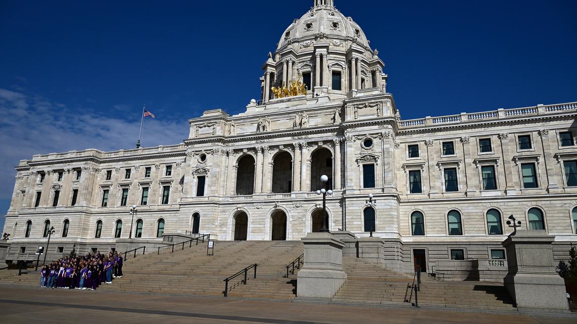 A group of visitors pose for a photo on the steps of the state Capitol building in St. Paul, Minn., on Wednesday, March 25, 2026. (John Autey/Pioneer Press/TNS)