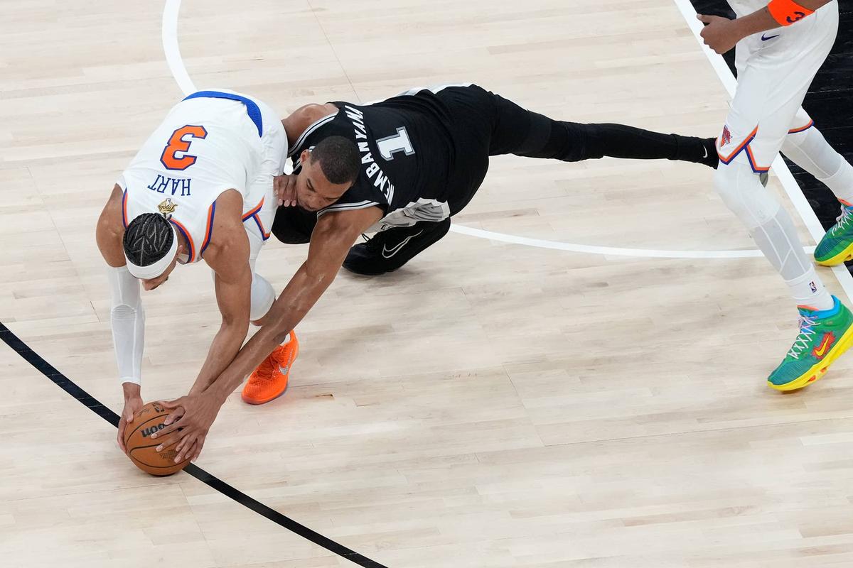  San Antonio Spurs forward Victor Wembanyama (1) attempts to steal the ball from New York Knicks guard Josh Hart after turning it over. Scott Wachter-Imagn Images