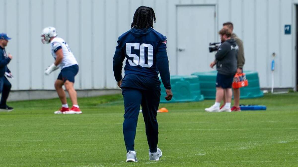  New England Patriots edge rusher Gabe Jacas walks on the field during the team's rookie minicamp. | Contributed by Sophie Weller / PatriotsWire 