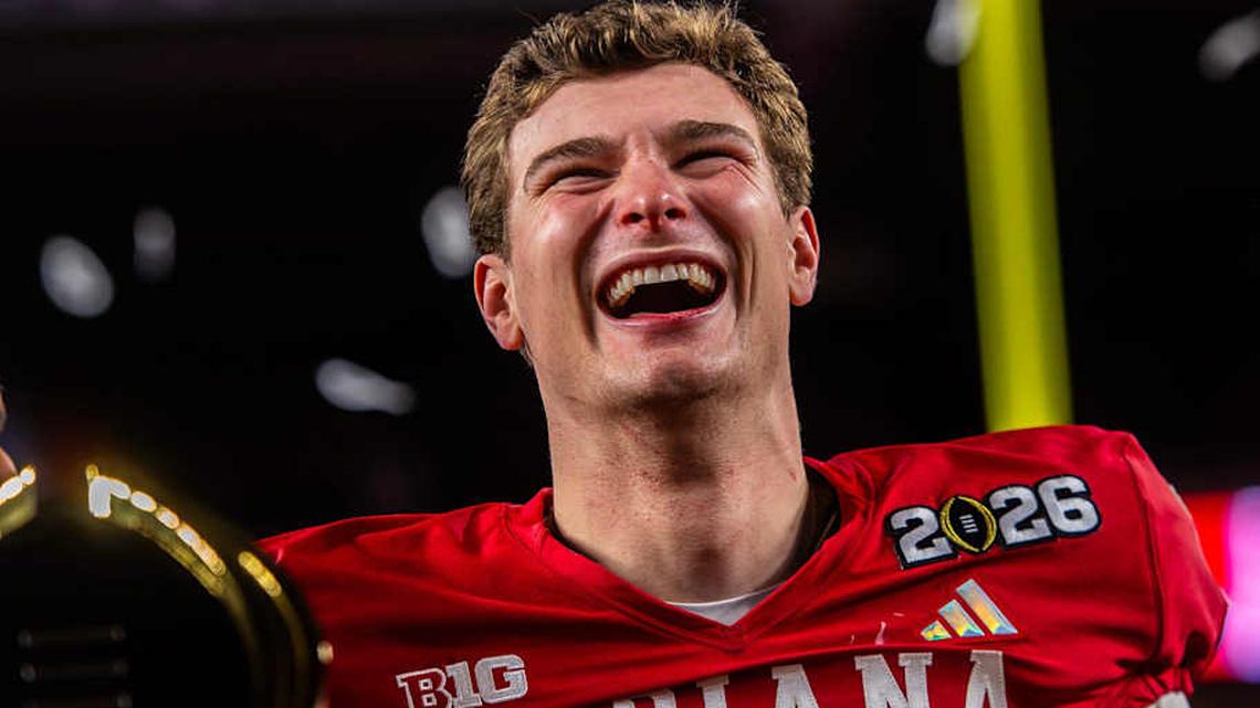  Indiana's Fernando Mendoza (15) smiles on the podium after the College Football Playoff National Championship college football game at Hard Rock Stadium in Miami Gardens on Monday, Jan. 19, 2026. | Rich Janzaruk/Herald-Times / USA TODAY NETWORK via Imagn Images 