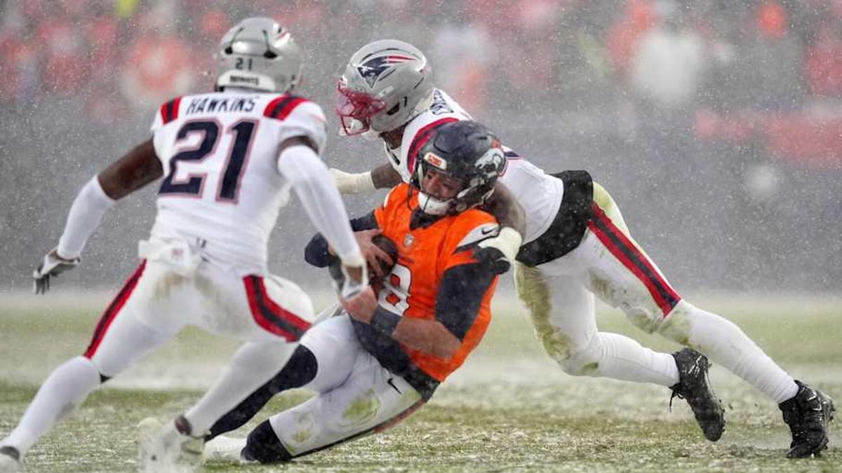  Jan 25, 2026; Denver, CO, USA; Denver Broncos quarterback Jarrett Stidham (8) rushes the ball against the New England Patriots during the second half in the 2026 AFC Championship Game at Empower Field at Mile High. Mandatory Credit: Ron Chenoy-Imagn Images | Ron Chenoy-Imagn Images 