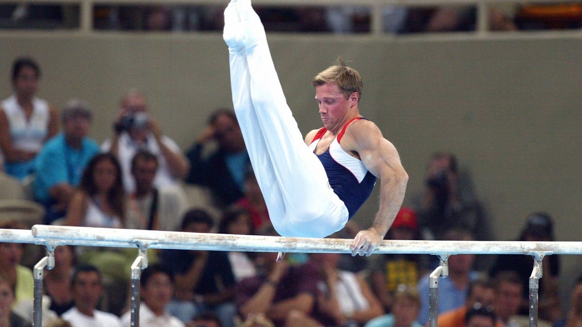 Retired Gymnastics World Champion, 51, Still Pulls Off His Iconic High Bar Move Like It's Nothing 