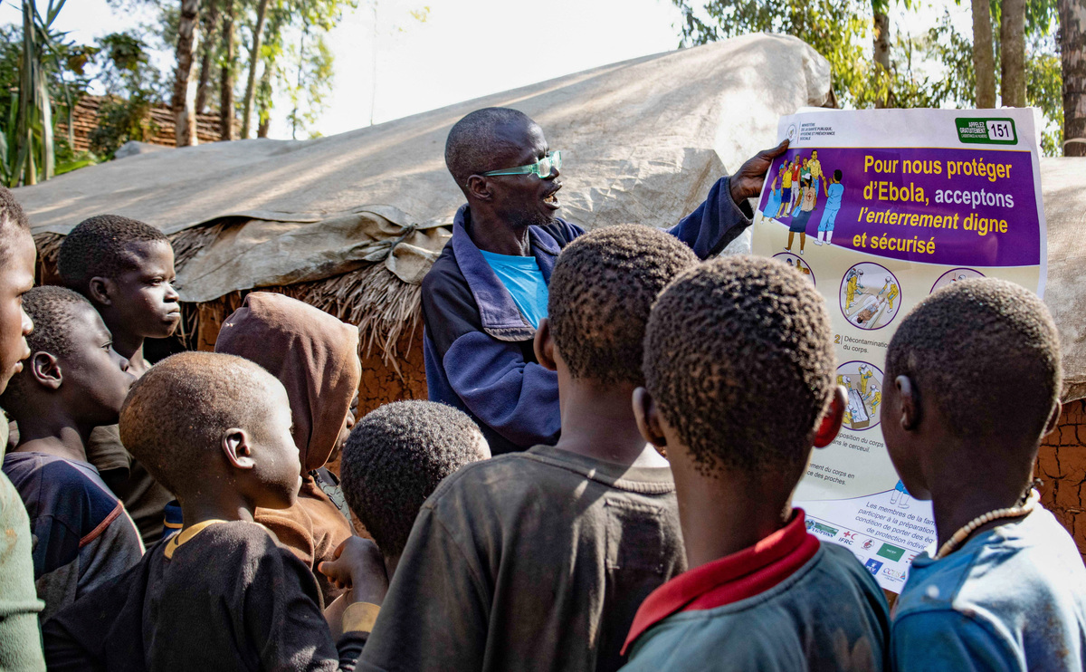 Dz'na Lipe Jean‑Marie, secretary of the displacement camp, speaks during an Ebola awareness session as humanitarian agencies intensify efforts to contain a new Ebola outbreak involving the Bundibugyo strain, at Kpangba displacement camp where Ebola cases were observed, Djugu territory in Ituri province, Democratic Republic of Congo, June 13, 2026. REUTERS/Gradel Muyisa Mumbere.