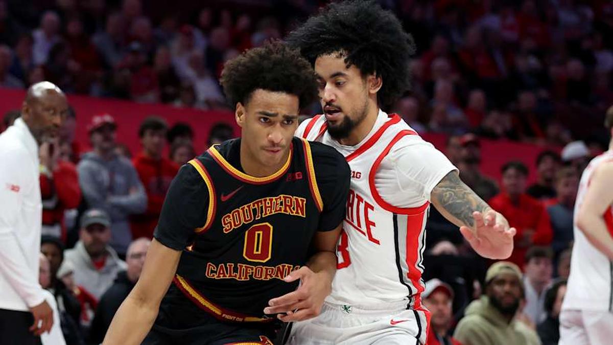  Feb 11, 2026; Columbus, Ohio, USA; USC Trojans guard Alijah Arenas (0) dribbles the ball as Ohio State Buckeyes guard Taison Chatman (3) defends during the first half at Value City Arena. Mandatory Credit: Joseph Maiorana-Imagn Images | Joseph Maiorana-Imagn Images 
