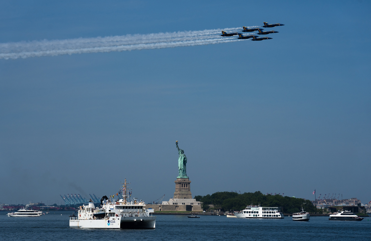 Jets fly above New York for the boat parade July 4, 2026. America celebrates the 250th anniversary of its independence today, with people from one end of the country to the other marking the milestone with fireworks, parades and concerts. (Juan Arredondo/The New York Times)