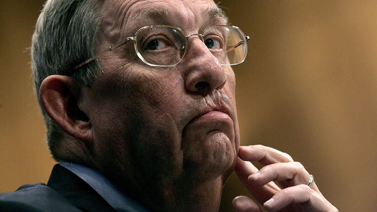 WASHINGTON - NOVEMBER 9: Lee Raymond, chairman and CEO of ExxonMobil Corporation, gestures as he testifies before a joint hearing of two Senate committees on energy pricing and profits in Washington on Nov. 9, 2005. Raymond, who as CEO helped make the global oil company the most profitable in its industry while resisting the scientific consensus that burning fossil fuels was causing a potentially disastrous warming of the Earth, died June 6. He was 87.