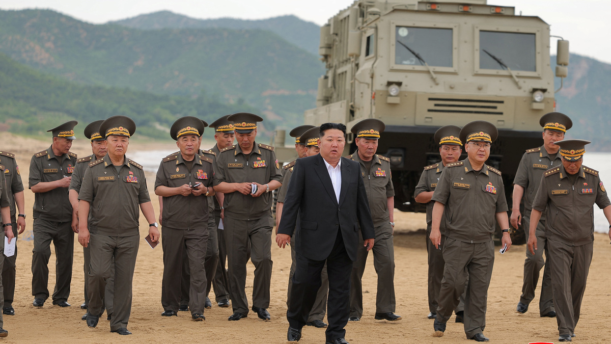 FILE PHOTO: North Korean leader Kim Jong Un oversees the test of key weapons, involving an upgraded version of a 240-mm, 24-tube multiple rocket launcher system, tactical ballistic missiles, and a 155-mm self-propelled howitzer, in North Korea, June 25, 2026, in this picture released by North Korea's official Korean Central News Agency. KCNA via REUTERS/File Photo