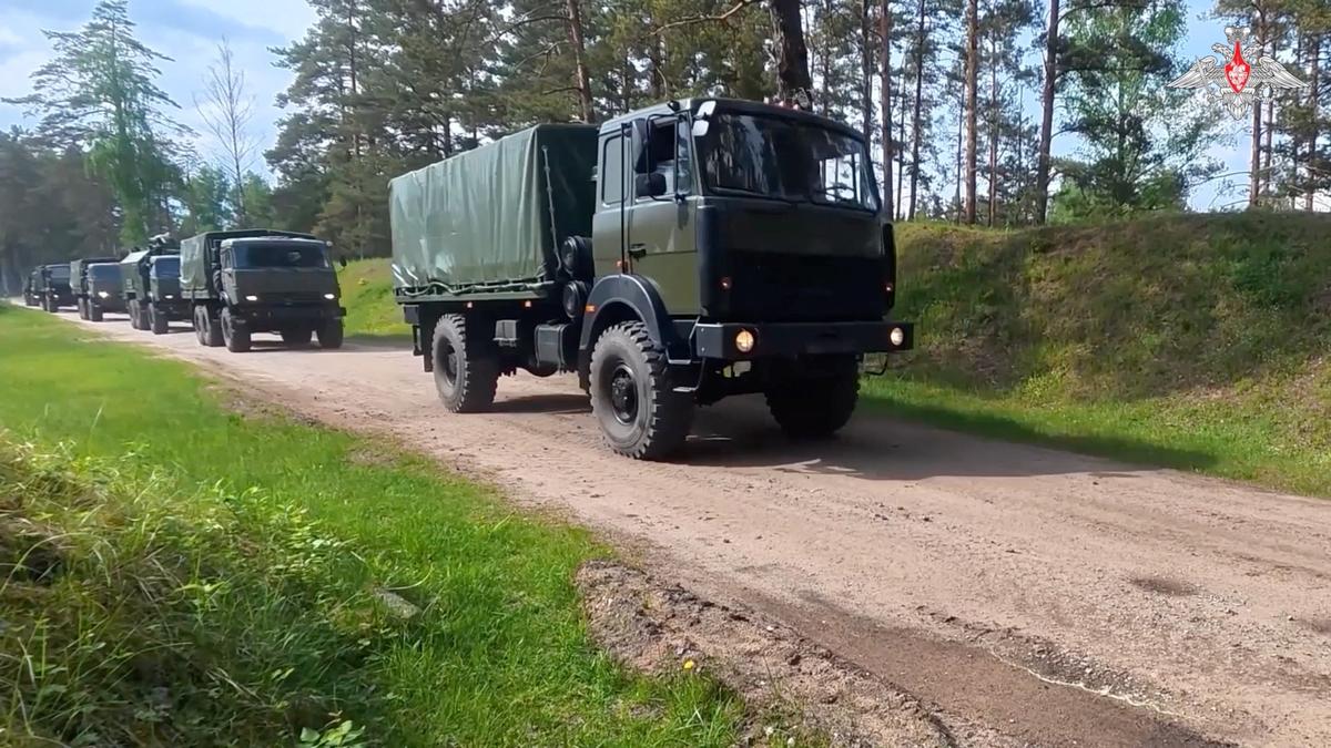 Military trucks drive along a road during nuclear forces exercises at an unidentified location in Belarus, in this still image taken from handout footage released on May 21, 2026. Russia delivered nuclear munitions to field storage facilities in Belarus as part of major nuclear drills, the Russian Defence Ministry said on Thursday. Russian Defence Ministry/Handout via REUTERS