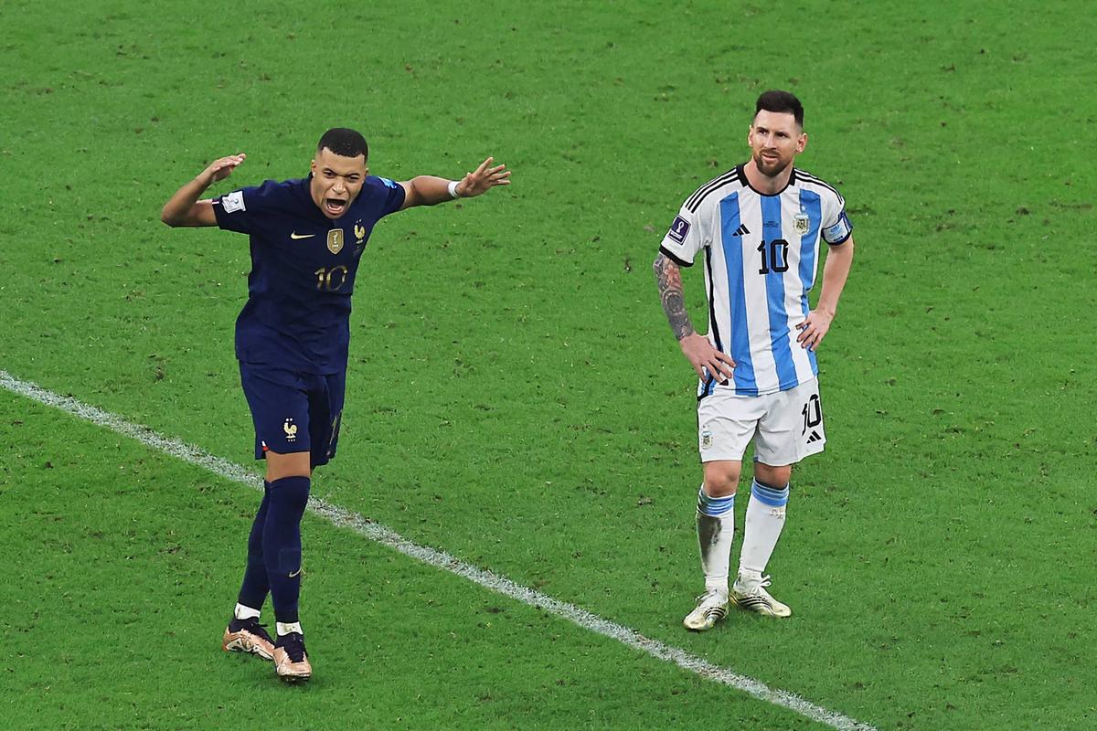  Kylian Mbappe of France celebrates after scoring the team's third goal walking past Lionel Messi of Argentina during the FIFA World Cup Qatar 2022 Final match. Buda Mendes/Getty Images