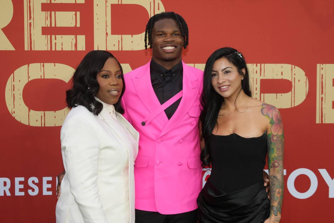  Apr 24, 2025; Green Bay, WI, USA; Colorado Buffaloes wide receiver Travis Hunter with his mother Ferrante Harris and his fiancee Leanna Lenee on the red carpet before the 2025 NFL Draft at Lambeau Field. Mandatory Credit: Kirby Lee-Imagn Images 
