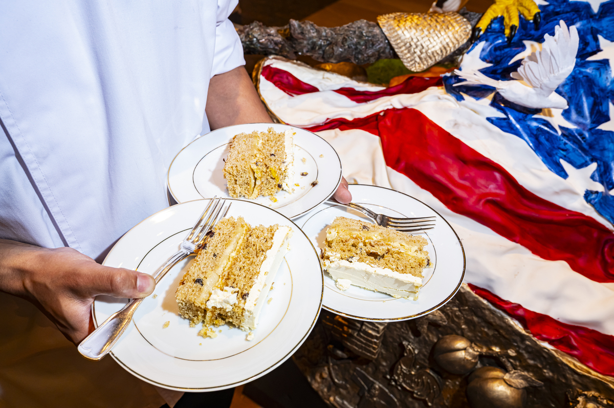 Attendees enjoy slices of "America's birthday cake", at the Library of Congress in Washington, on Saturday, July 4, 2026. America celebrates the 250th anniversary of its independence today, with people from one end of the country to the other marking the milestone with fireworks, parades and concerts. (Scott Schuman/The New York Times)