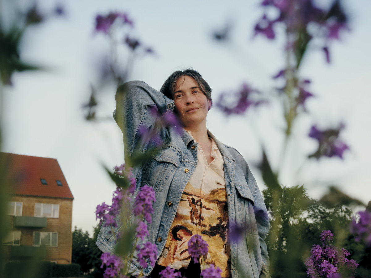 Danish author Linea Maja Ernst in Copenhagen, Denmark, June 1, 2026. Ernst is polyamorous, but her wife isn't. Although they love each other, they still haven't quite "figured it out," much like some of the characters in her debut novel. (Mathias Eis/The New York Times)