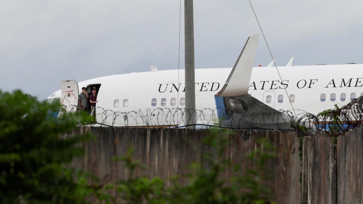 People stand at the gate of a U.S. government plane on the tarmac before departure at Jose Marti International Airport in Havana, Cuba, May 14, 2026. REUTERS/Norlys Perez