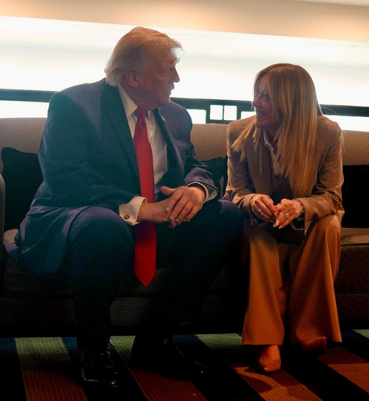 U.S. President Donald Trump speaks to Italian Prime Minister Giorgia Meloni on the sidelines of the G7 Summit in Evian-les-Bains, France, June 17, 2026. Italian Prime Ministry/Handout via REUTERS