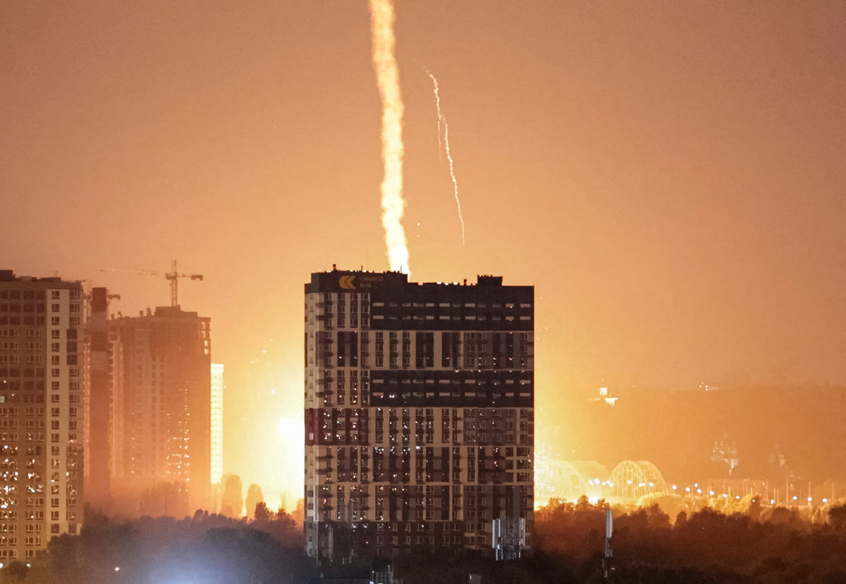 An explosion lights up the sky over the city during a Russian missile and drone strike, amid Russia's attack on Ukraine, in Kyiv, Ukraine July 6, 2026. REUTERS/Vladyslav Sodel