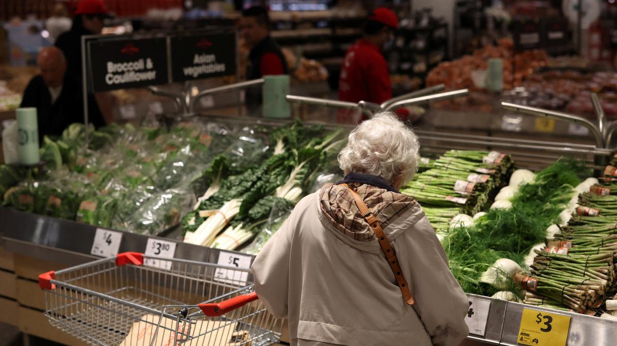 A shopper looks at vegetables displayed at a Coles supermarket in Bondi Junction, in Sydney, Australia, October 29, 2025. REUTERS/Hollie Adams