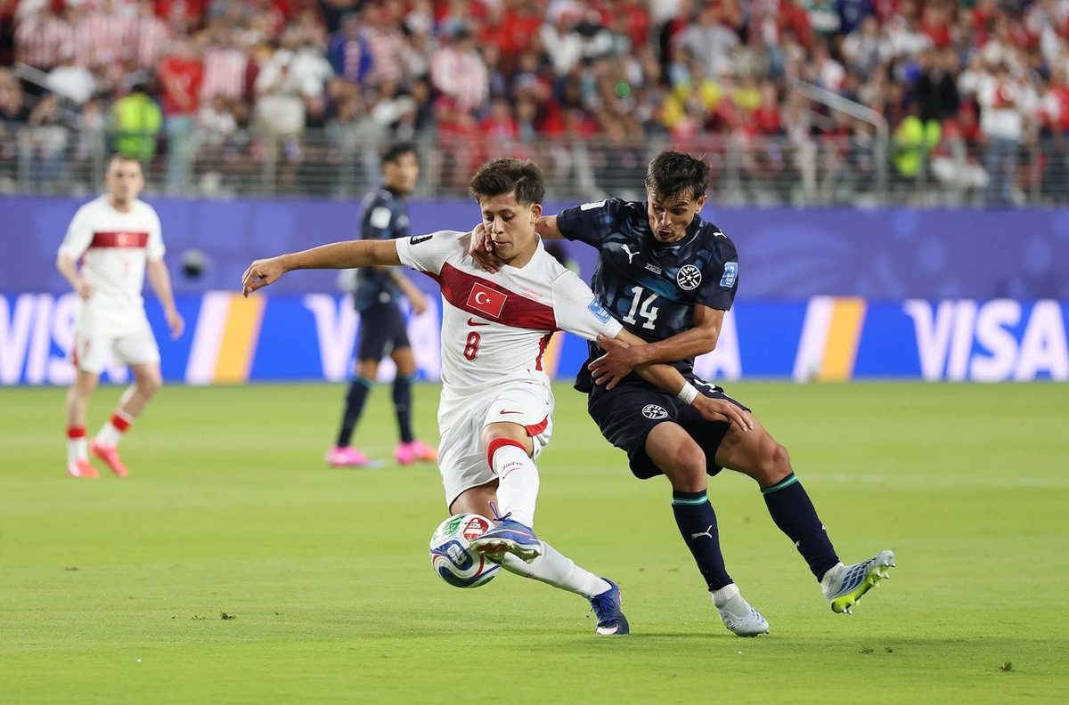  Arda Guler #8 of Turkiye is challenged by Andres Cubas #14 of Paraguay during the FIFA World Cup 2026 Group D match at San Francisco Bay Area Stadium on June 19, 2026 in Santa Clara, California. Photo by Richard Heathcote/Getty Images