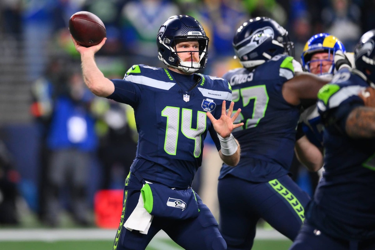  Jan 25, 2026; Seattle, WA, USA; Seattle Seahawks quarterback Sam Darnold (14) passes against the Los Angeles Rams during the second half in the 2026 NFC Championship Game at Lumen Field. Mandatory Credit: Steven Bisig-Imagn Images 