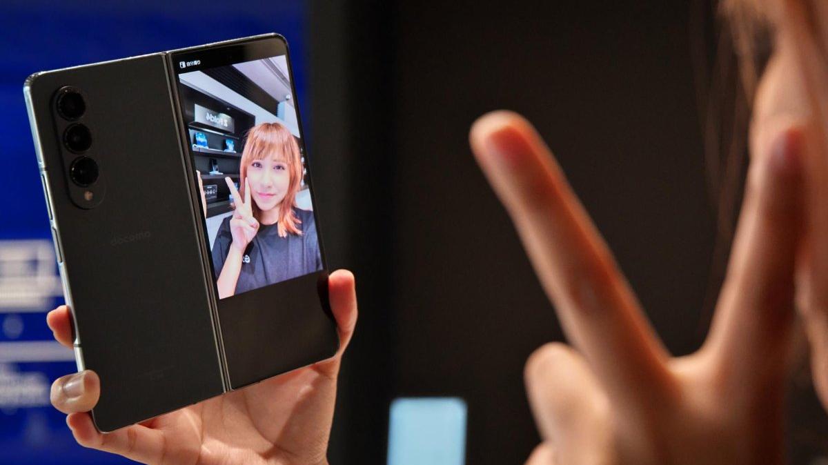 A employees poses with a Galaxy phone during launch day in 2022 at the Samsung Harajuku store in Tokyo. A study released Wednesday in the journal Nature said that social media platform TikTok prioritized pro-Republican for many users leading up to the 2024 election. File Photo by Keizo Mori/UPI