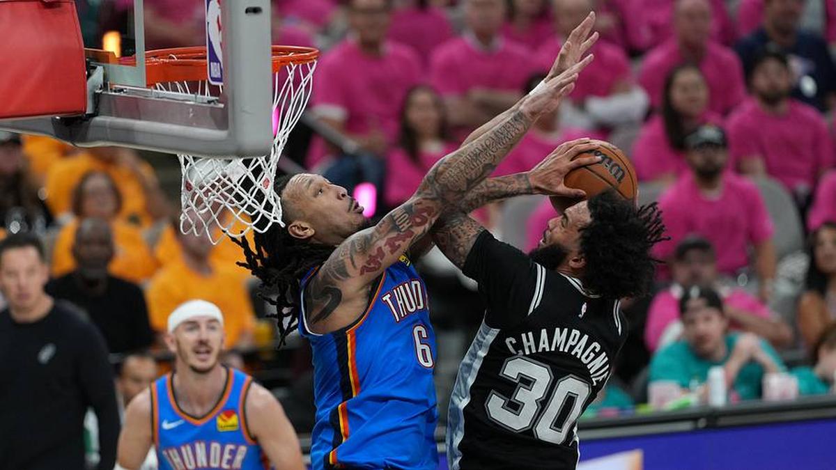  Spurs forward Julian Champagnie shoots the ball over Thunder forward Jaylin Williams. | Daniel Dunn-Imagn Images 