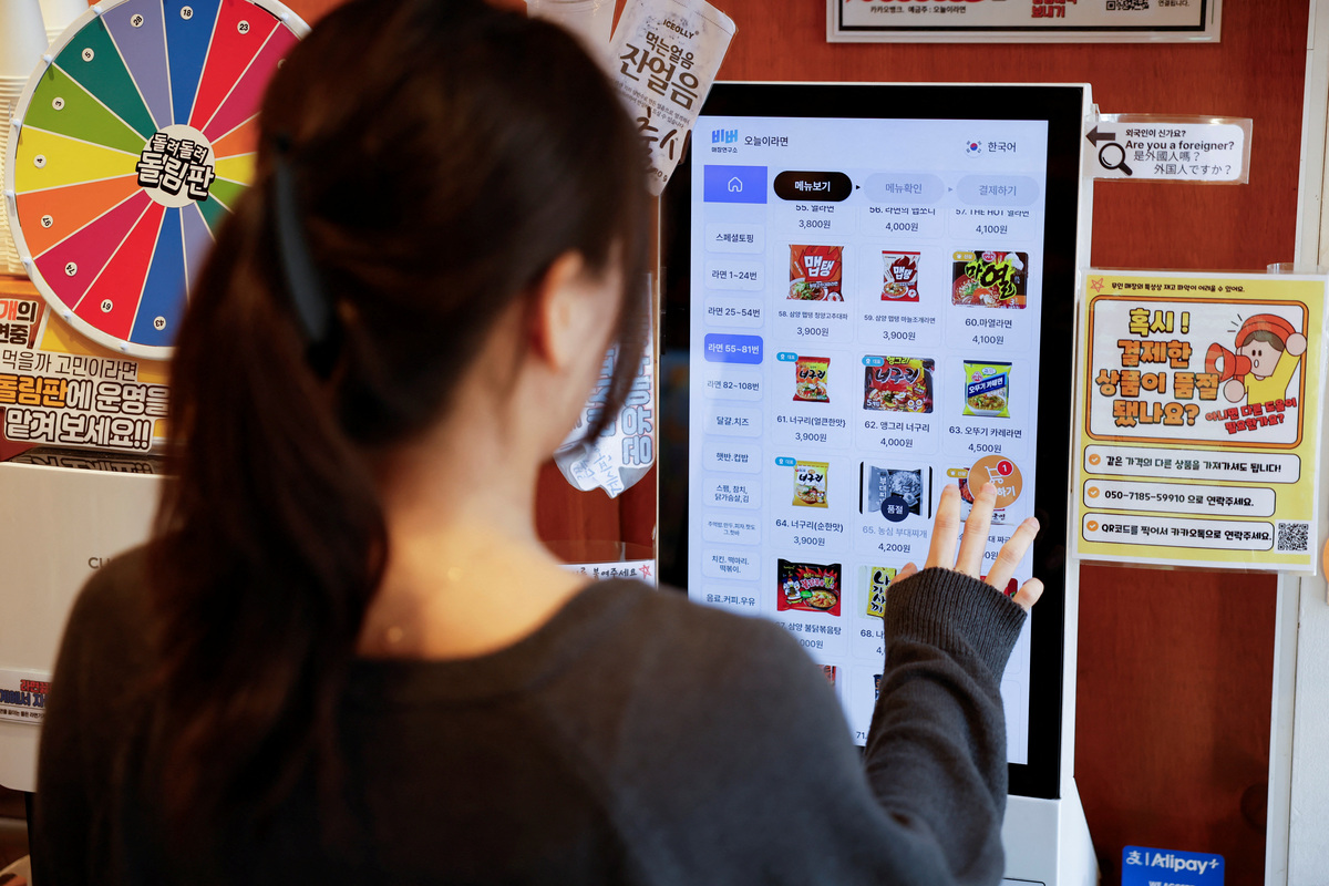 A customer places an order at a kiosk at an unmanned ramen eatery in Seoul, South Korea, June 5, 2026. REUTERS/Kim Soo-hyeon