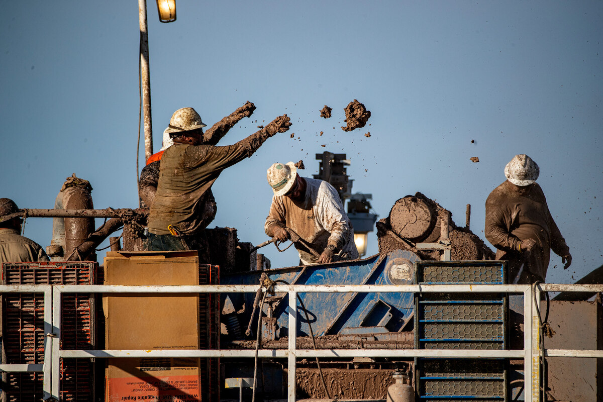  Workers remove clay batches while extracting mud from the drilling well at the Controlled Thermal Resources geothermal energy and lithium plant on the south side of the Salton Sea on November 9, 2021, in Calipatria, Calif. Credit: Gina Ferazzi/Los Angeles Times via Getty Images
