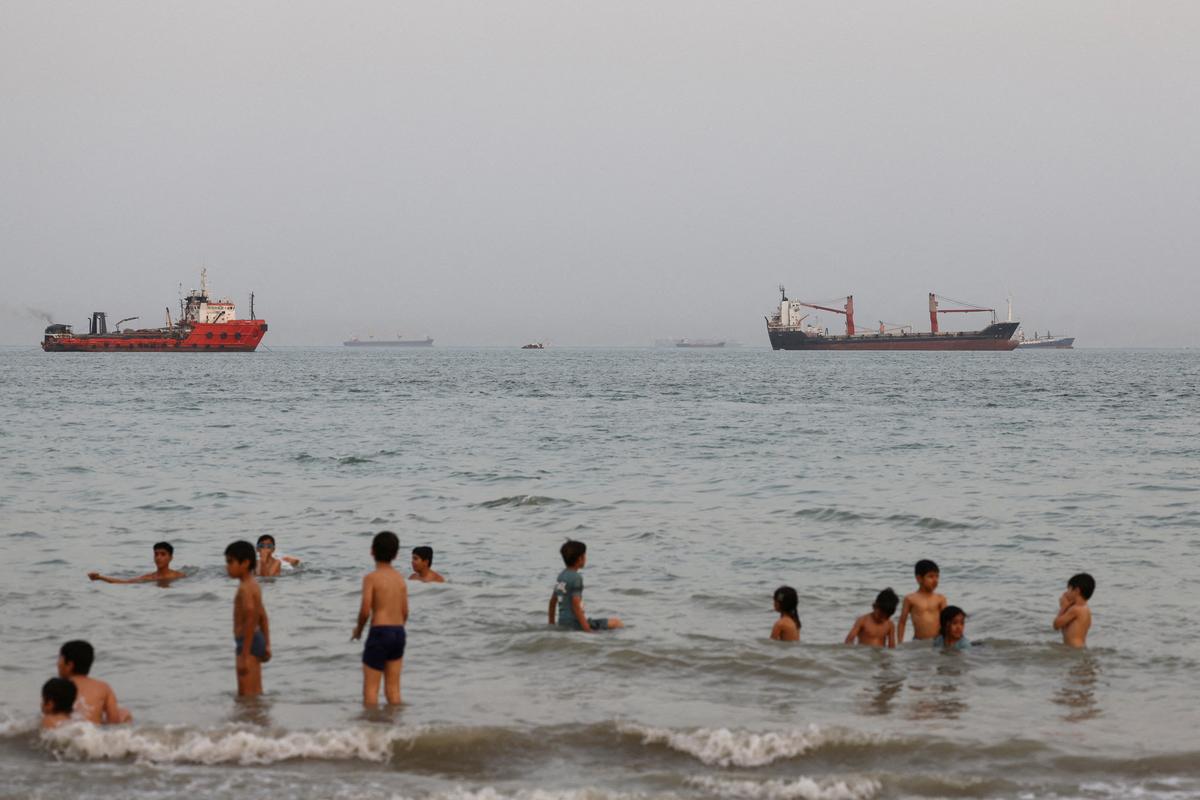 Vessels in the Strait of Hormuz are visible near the beach of Bandar Abbas, Iran, May 22, 2026. Majid Asgaripour/WANA (West Asia News Agency) via REUTERS ATTENTION EDITORS - THIS PICTURE WAS PROVIDED BY A THIRD PARTY