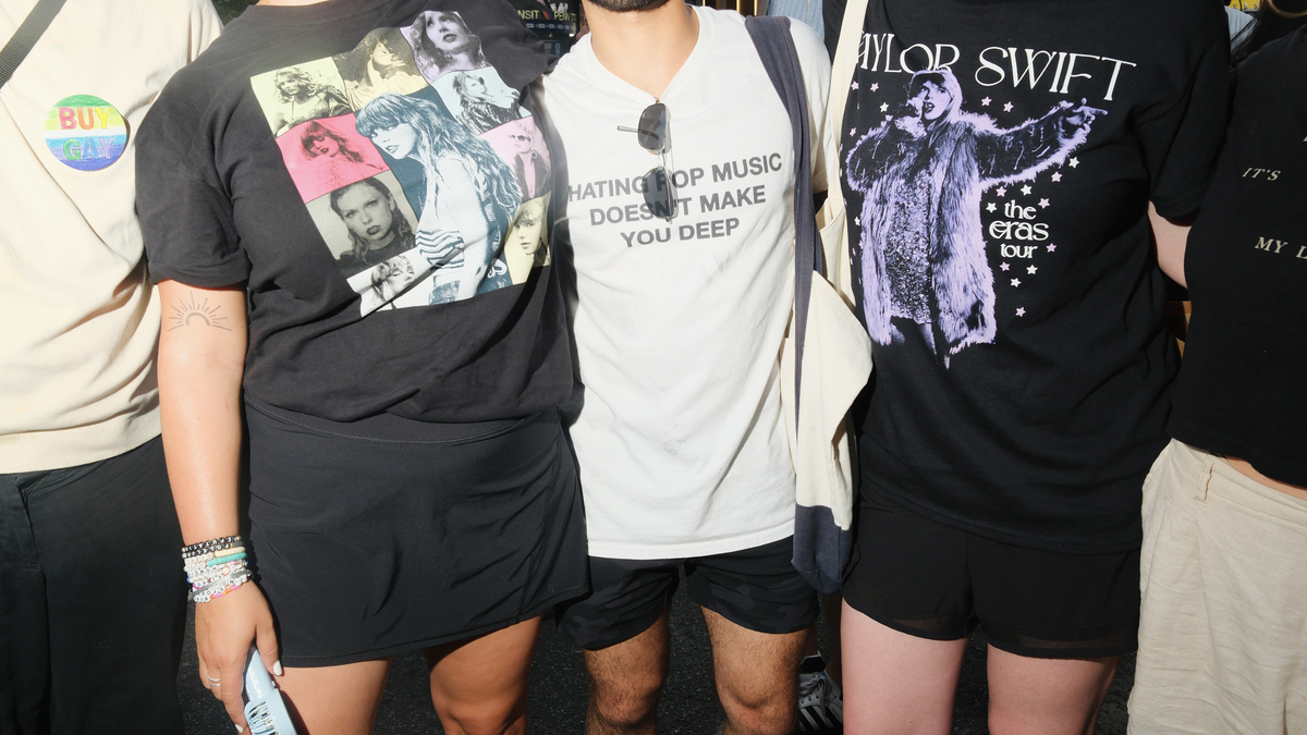 Fans wear Taylor Swift shirts near Madison Square Garden during the pop star's wedding to Travis Kelce in New York on July 3, 2026. Inspired by Taylor Swift and Travis Kelce's $26 million charitable gifts, Swifties are expressing their own generosity through donations to causes the couple supports.